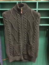 Wool aran knit vest. Sleeveless. Full Zip. Pockets on the front.  Dark grey colour
